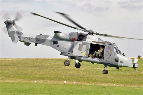 AgustaWestland AW159 Wildcat helicopter flying over a ship