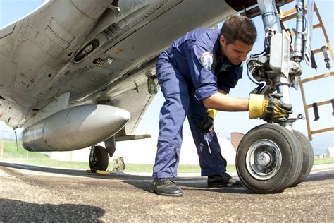 An Air Force airplane mechanic inspecting an engine