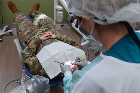 Air Force Dental Hygienist with Patient