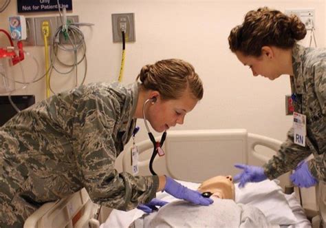 Air Force Nurse Caring for Patient