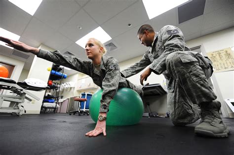 Air Force physical therapists working with an Airman