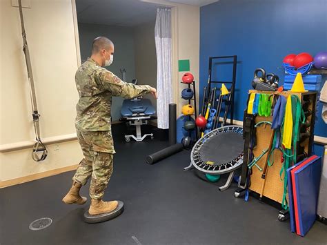 Air Force Physical Therapist Working with Team