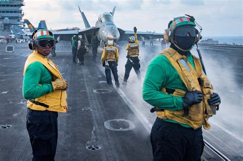 Aircraft carrier crew at work