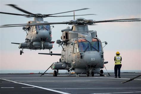 Helicopter taking off from an aircraft carrier