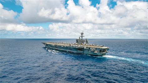 Coast Guard personnel on an aircraft carrier