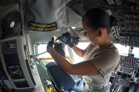 Aircrew Flight Equipment Specialist inspecting aircraft