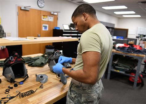 Aircrew Flight Equipment Specialist inspecting equipment