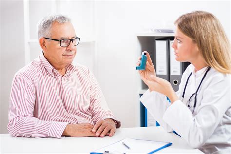 An allergist counseling a patient