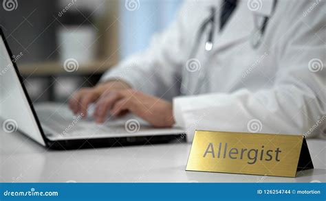 An allergist prescribing medicine