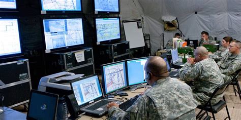 Army Information Technology Specialist working on a computer