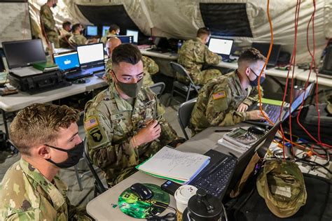 A group of soldiers in uniforms, with intelligence equipment