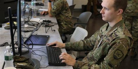 Army IT Specialist working on computer