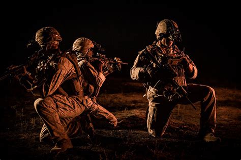 Soldiers socializing at a night bar