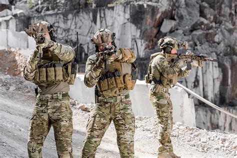 A photo of Army soldiers in uniform, with a cityscape in the background