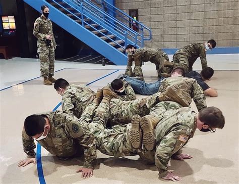 Soldiers work together to complete a task