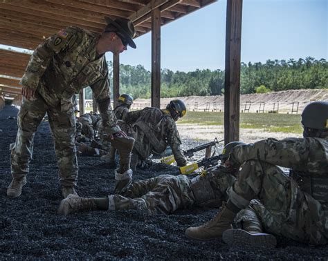 A soldier in uniform, participating in a training exercise.