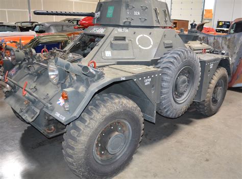 A military vehicle, with a soldier in the driver's seat