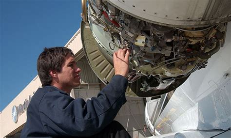 Avionics Technician Repairing Equipment