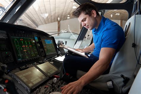 Avionics Technician Working on Aircraft