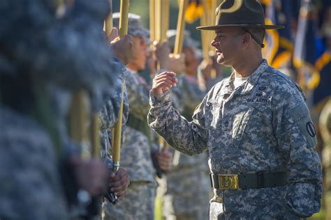 Drill instructors guiding recruits during training