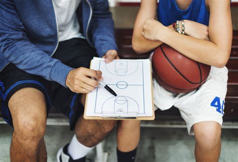 Basketball coaches discussing strategy