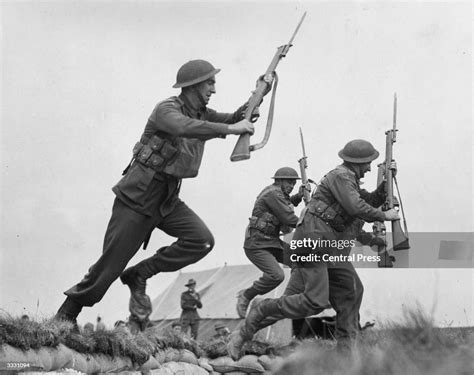 Soldiers advancing with fixed bayonets