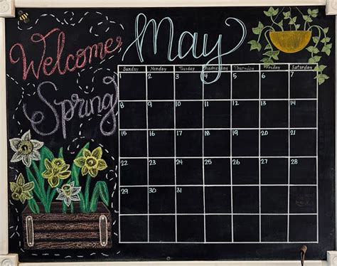 A person using a chalkboard calendar to plan their day