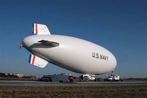 Blimp in flight at sunset