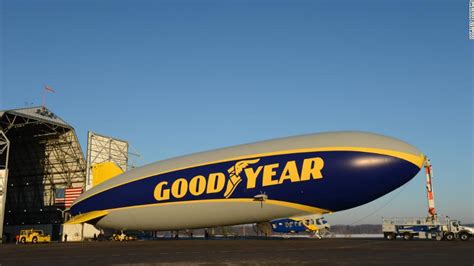 Blimp in flight over a city