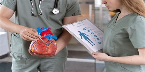 A cardiac technician operating an ECG machine