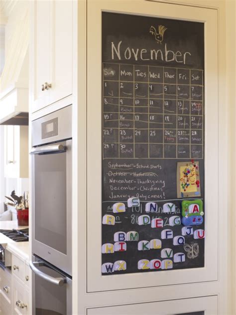 A chalkboard calendar in a kitchen