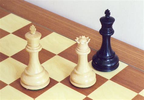 Chess pieces delivering a checkmate