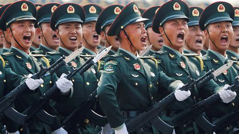 Chinese Military Personnel Inspect the J-20