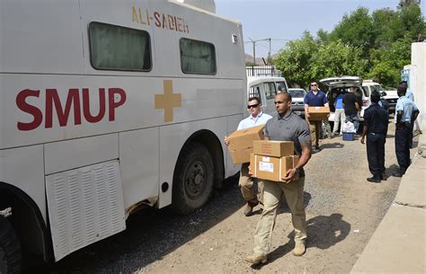 Civil Affairs Officer providing medical care