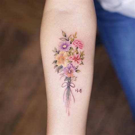 Colorful birth flower tattoos