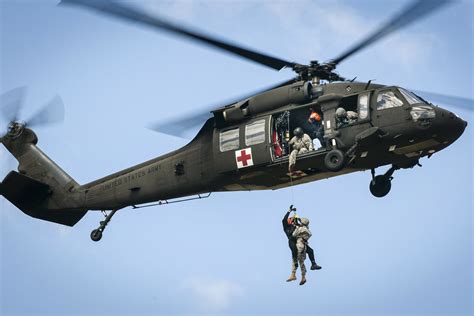 Combat medic in a helicopter, en route to a medical emergency