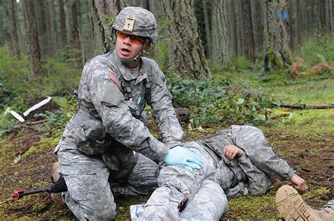 Combat medics in training, practicing medical procedures