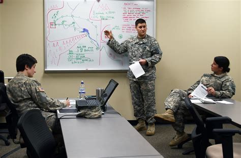 A commander attending a training course, with a laptop or tablet in front of them