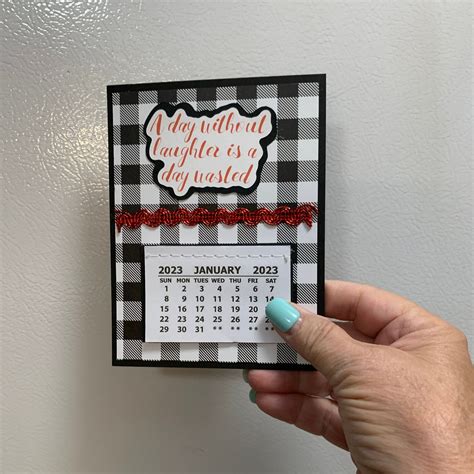 A close-up of a compact fridge calendar