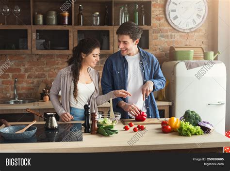 Couple cooking dinner together