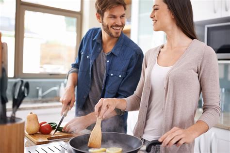 A couple taking a cooking class together, learning new skills