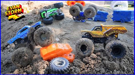 Fans gathered around a monster truck, taking photos