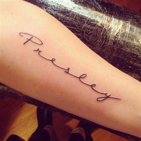 Cursive name tattoos