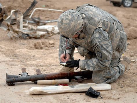 EOD techs destroying an explosive device