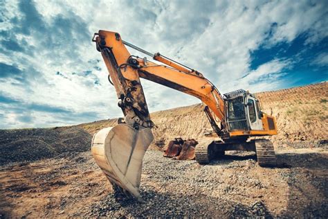 Excavator operator digging a trench