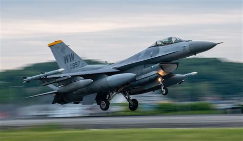 An F-16 Fighting Falcon taking off from a runway