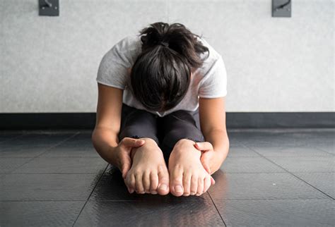 Female soldier doing sitting and reaching