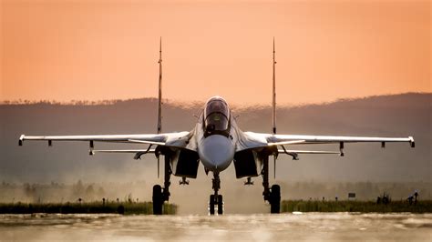 A fighter plane taking off from a runway