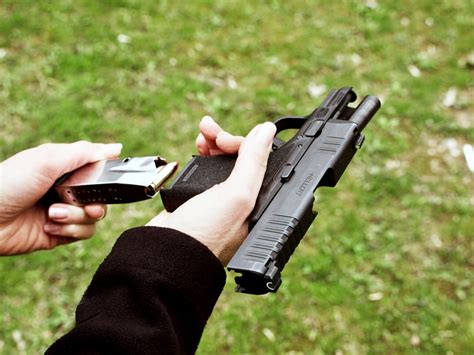 A person loading a firearm