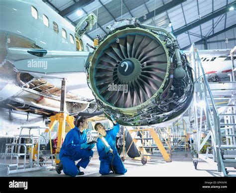 Flight Engineer Inspecting Engine